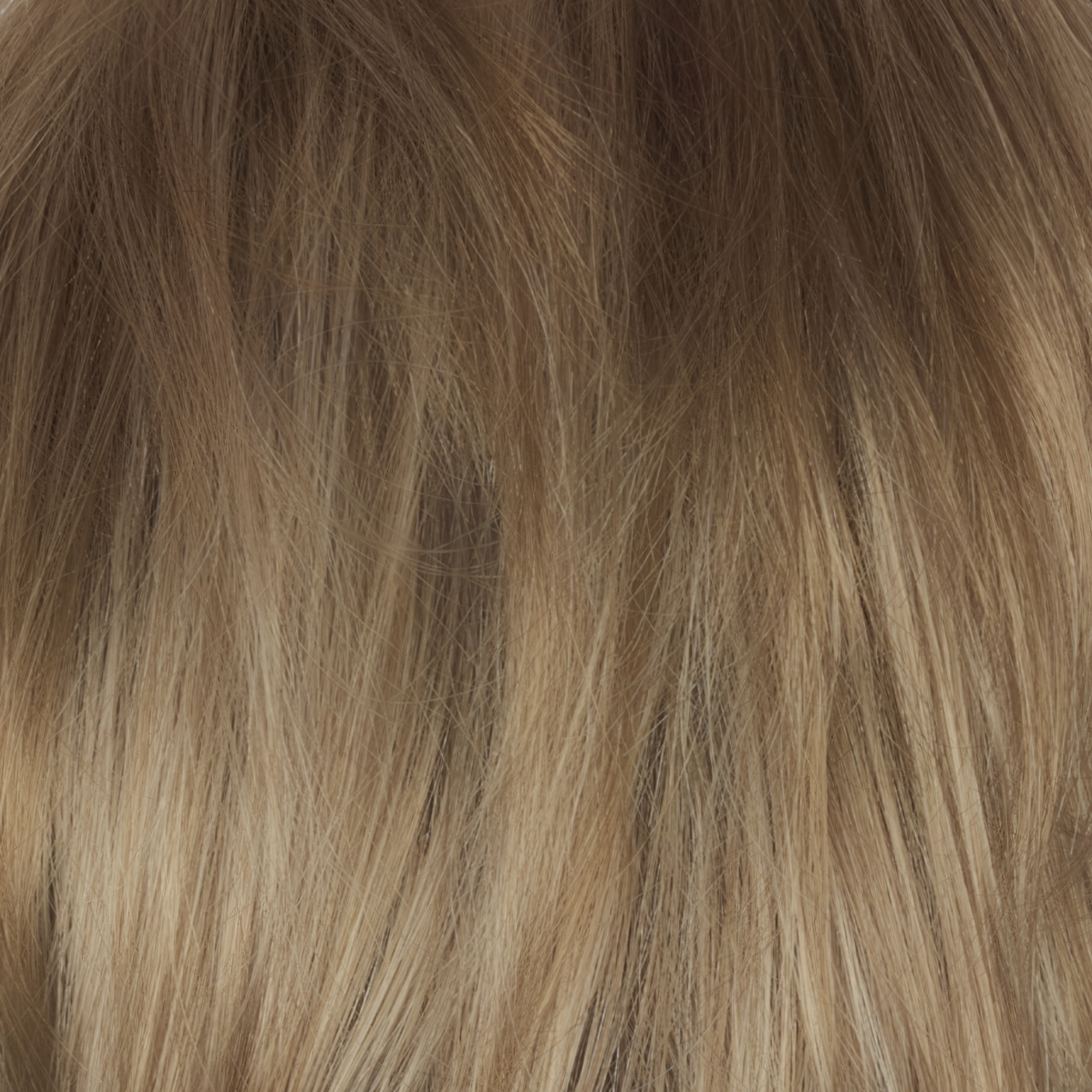 A dark/medium multi-tonal blond with a chocolate brown root regrowth that captures the essence of a summer sunset. This beautiful color is ideal for those who appreciate textured honey, ash and gold hues.