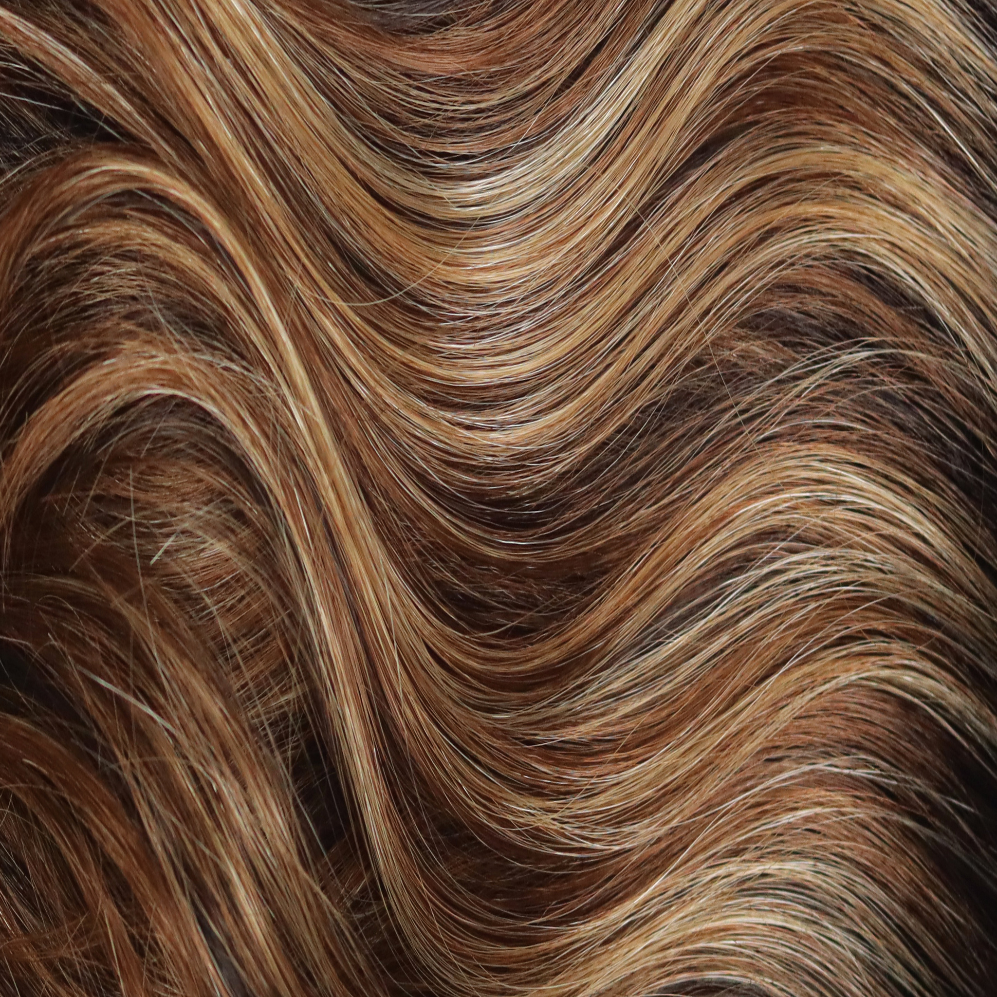 Chocolate Pretzel  -  A swirly delight as it combines a dark brown base with a delightful cascade of medium honey blond and medium coppery highlights. Empower any look with this modern brown color.