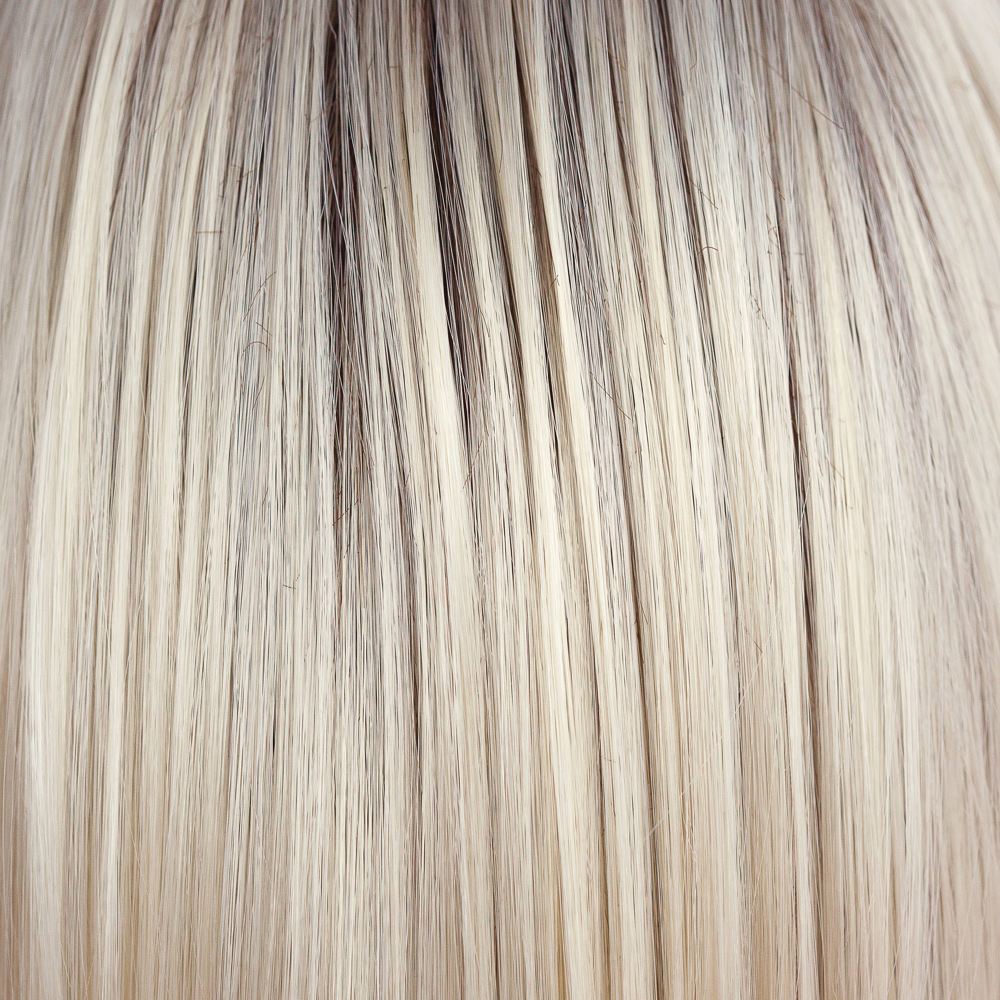 Coco Cream  -  A rich dark chocolate base that pushes the boundaries with its stunning displays of lily white chunky blond weaves and pale natural ash blond slices. Maximizing the impact of the style!