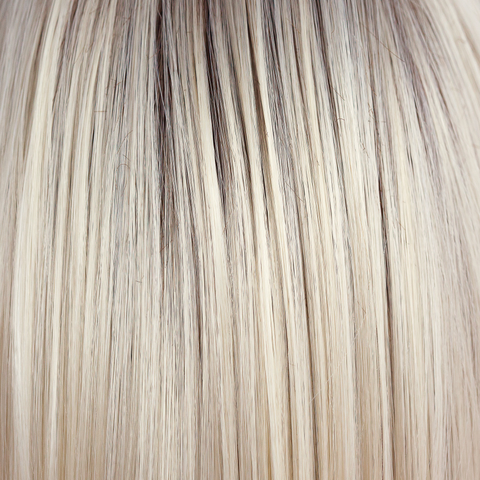 Coco Cream  -  A rich dark chocolate base that pushes the boundaries with its stunning displays of lily white chunky blond weaves and pale natural ash blond slices. Maximizing the impact of the style!