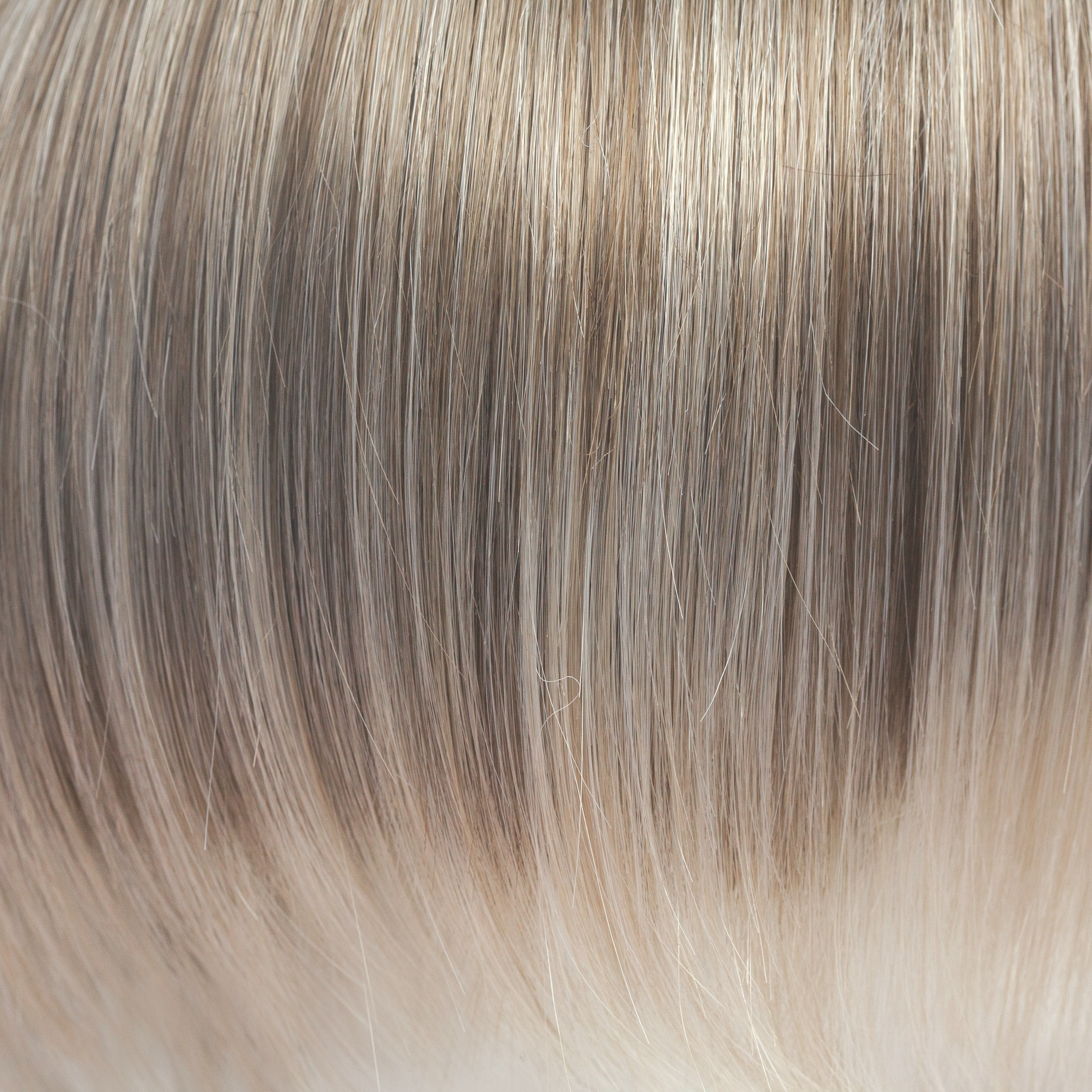 This captivating clever color has a blend of beautiful ash blond highlights and velvet blonds. Towards the ends of the hair you are hit with blocks of ice blonde tips. This Ice Blond color combination is great in any style. It is crisp and cool… we love it!