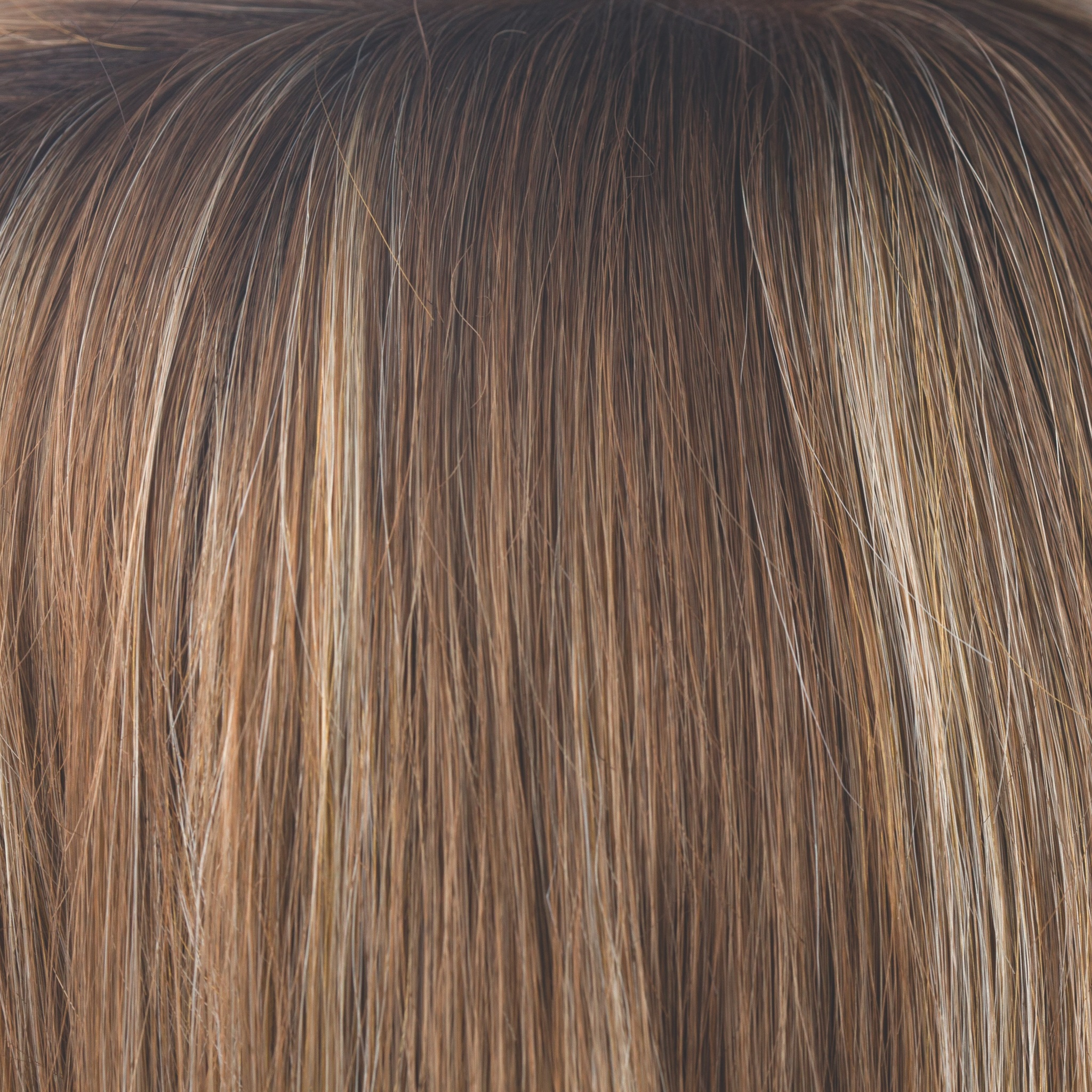 Maple Sugar-R  -  This dreamy color showcases a light, warm medium brown base with warm medium blond highlights. Warm, dark brown roots create any type of realistic length and style, making Maple Sugar-R a showstopper!