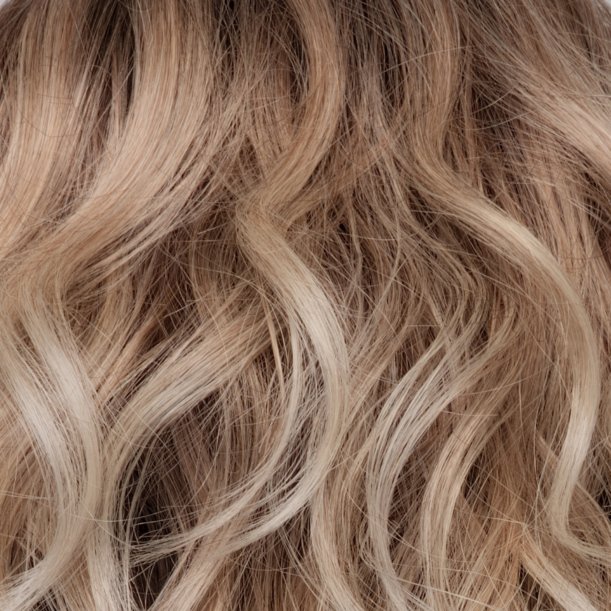Melted Sand  -  Rich, warm brown root melts into the neutral blond tone. Light-beige blond ends complete this stunning color.   