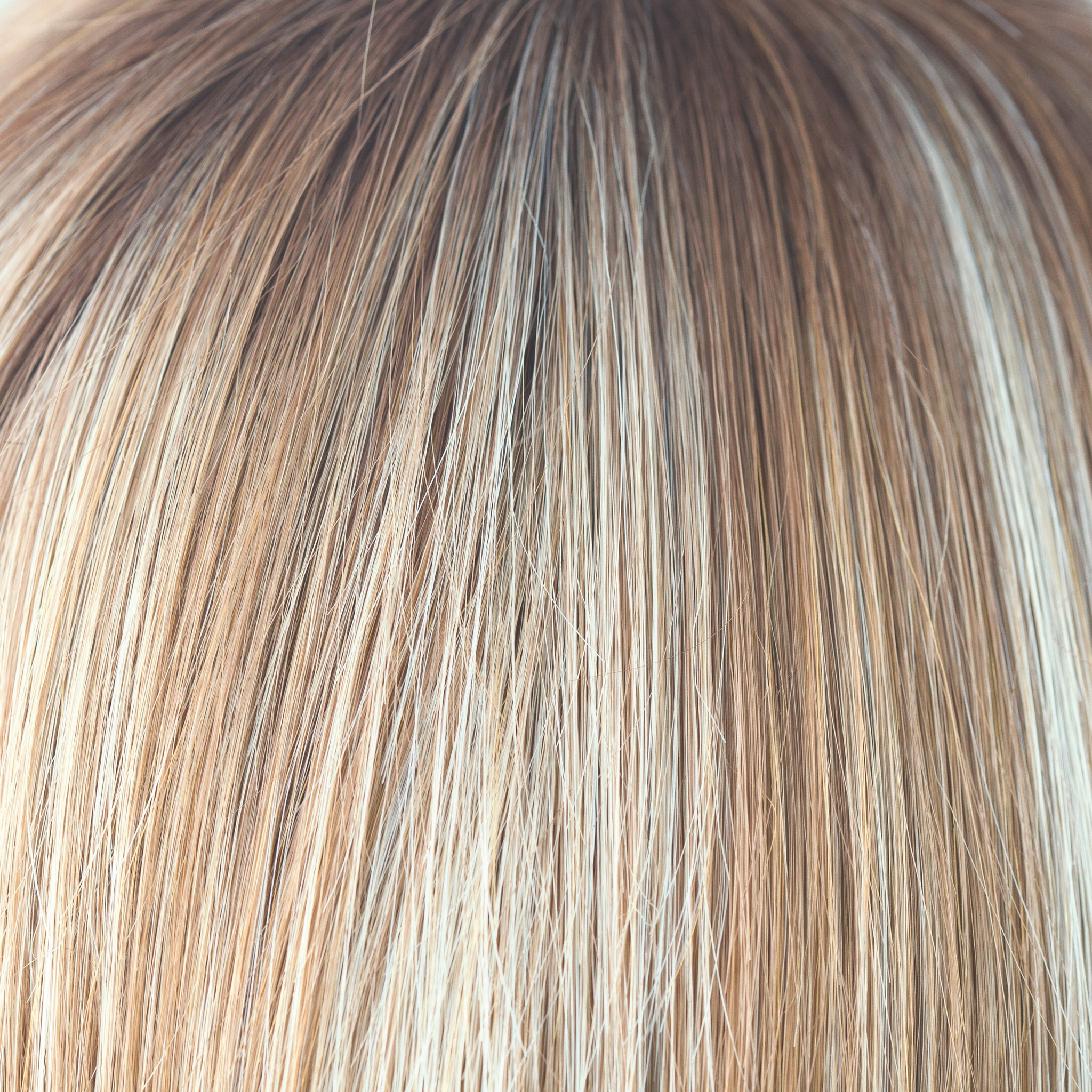 Nutmeg-R  -  This scrumptious rooted nutmeg blond with medium golden rooted base, blends into blond cream tones, warm coconut and honey slices. Nutmeg-R is classy and defined!