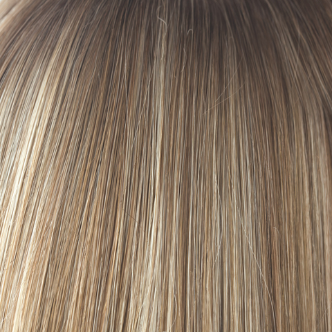 A natural and the root tone is a medium gold honey brown. There is a mix of white blonde highlights and strawberry blonds. Complemented with medium velvet brown undertones.